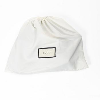 Gucci, a handbag.