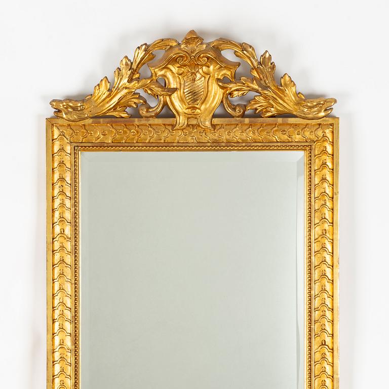 A Gustavian Style Mirror with Table, circa 1900.