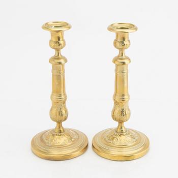 A pair of 19th century brass candle sticks.