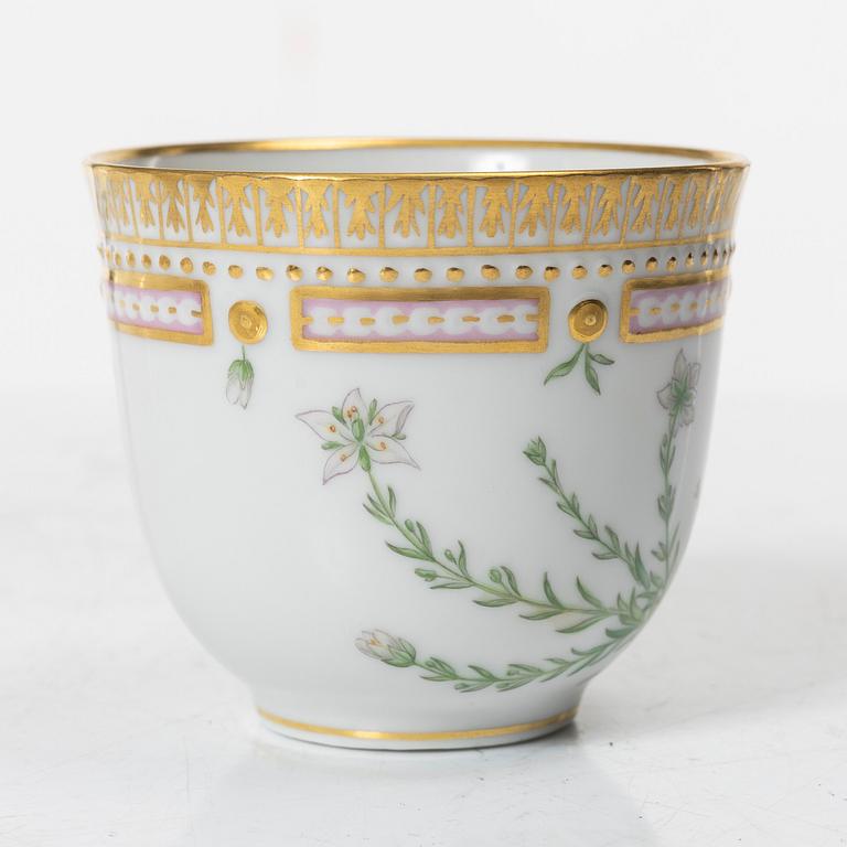A Royal Copenhagen 'Flora Danica' coffee cup with stand, Denmark, 20th Century.