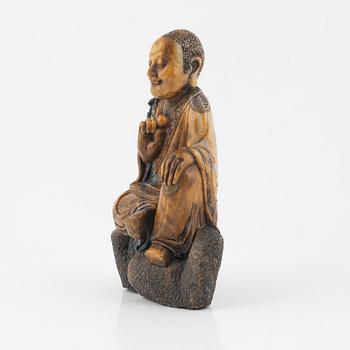 A soapstone sculpture of a lohan, late Qing dynasty.