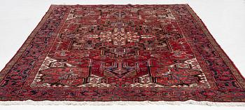 A Heris carpet, c. 345 x 245 cm.