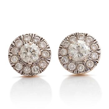 A pair of 18K white/yellowgold earrings set with brilliant cut diamonds approx. 3.40 ct in total. With certificate.