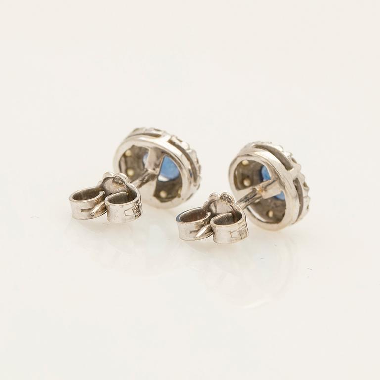 Earrings, a pair, 18k white gold with brilliant-cut diamonds and sapphire.