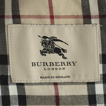 BURBERRY, a black cotton trench coat.
