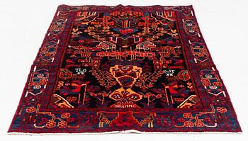 An oriental rug, ca 233 x 128 cm.