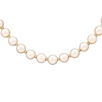 A necklace of cultured pearls, clasp of 18K gold, cabochon cut aquamarine and seed pearls, Atelier Ajour Stockholm 1963.