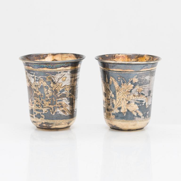 Four parcel-gilt silver beakers, Moscow 1870, 1876 and 1890.