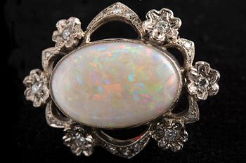 A BROOCH, brilliant- and 8/8 cyt diamonds c. 0.25 ct. Opal 22x15 mm. Marked KB Uppsala 1964. Weight 9,3 g.