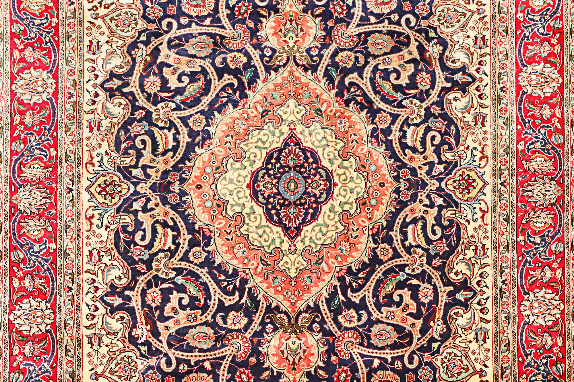 A Tabriz carpet, c. 345 x 255 cm.