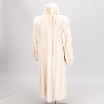 A Long White Mink Coat with a Hat by Osman Ali Finland.