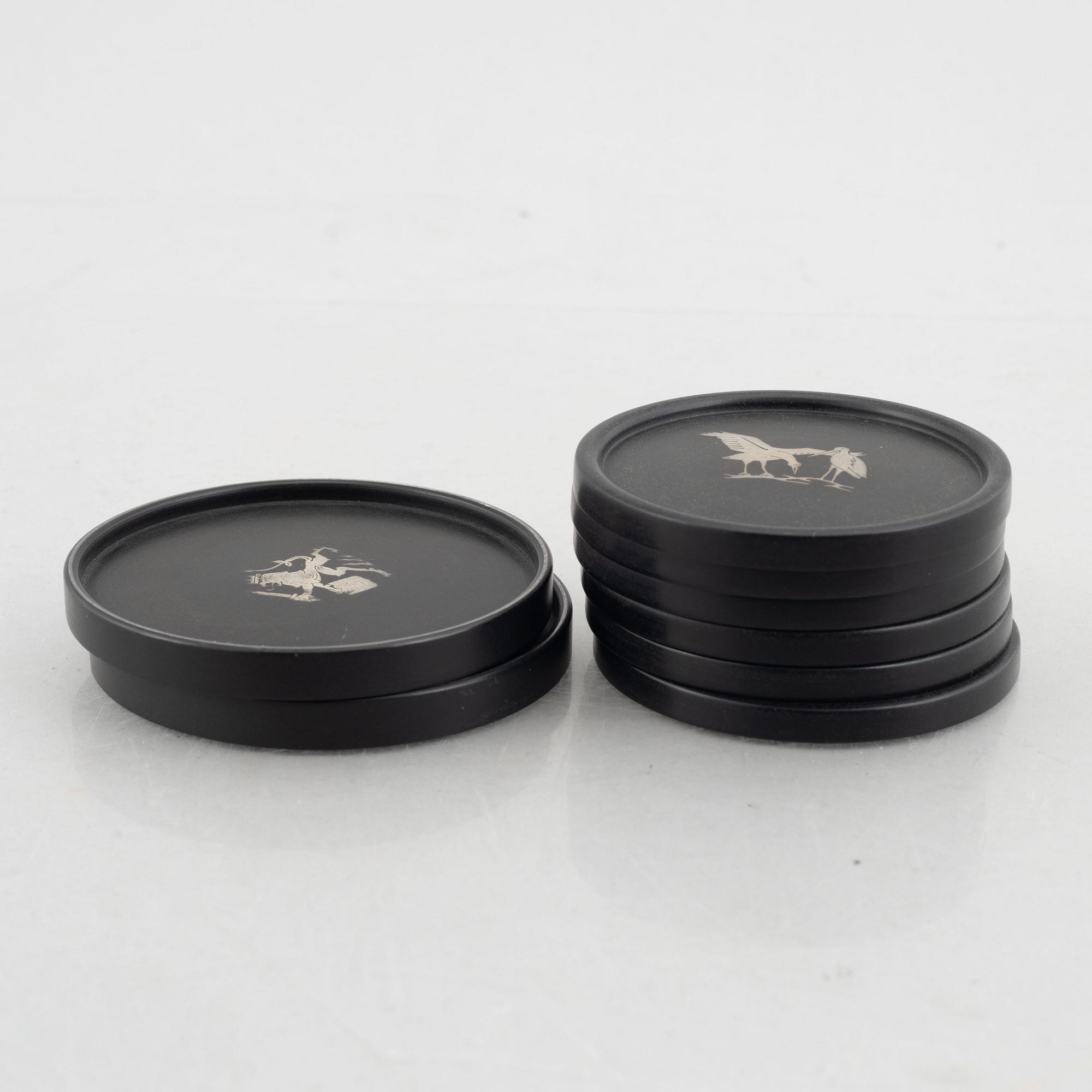 Eight coasters, Isolit with silver inlays, 1937-53.