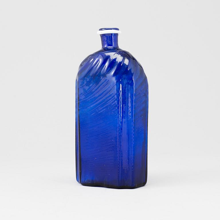 A late 18th or early 19th century glass bottle.