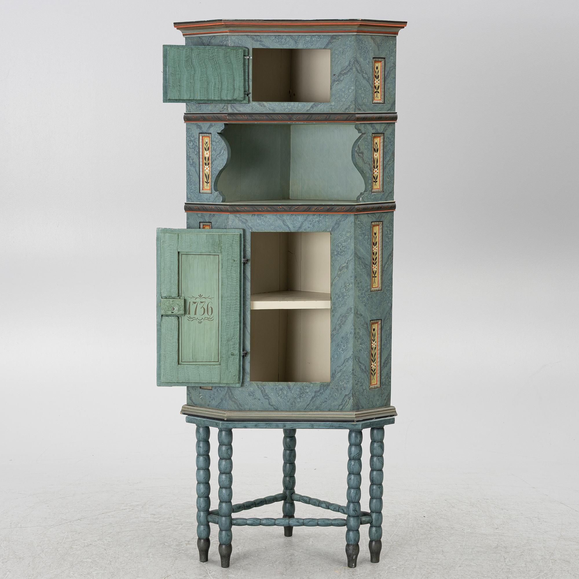 A corner cabinet, 20th century with older parts.