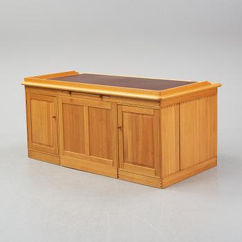 An oak writing desk by Finn N Hansen. End of the 20th Century.