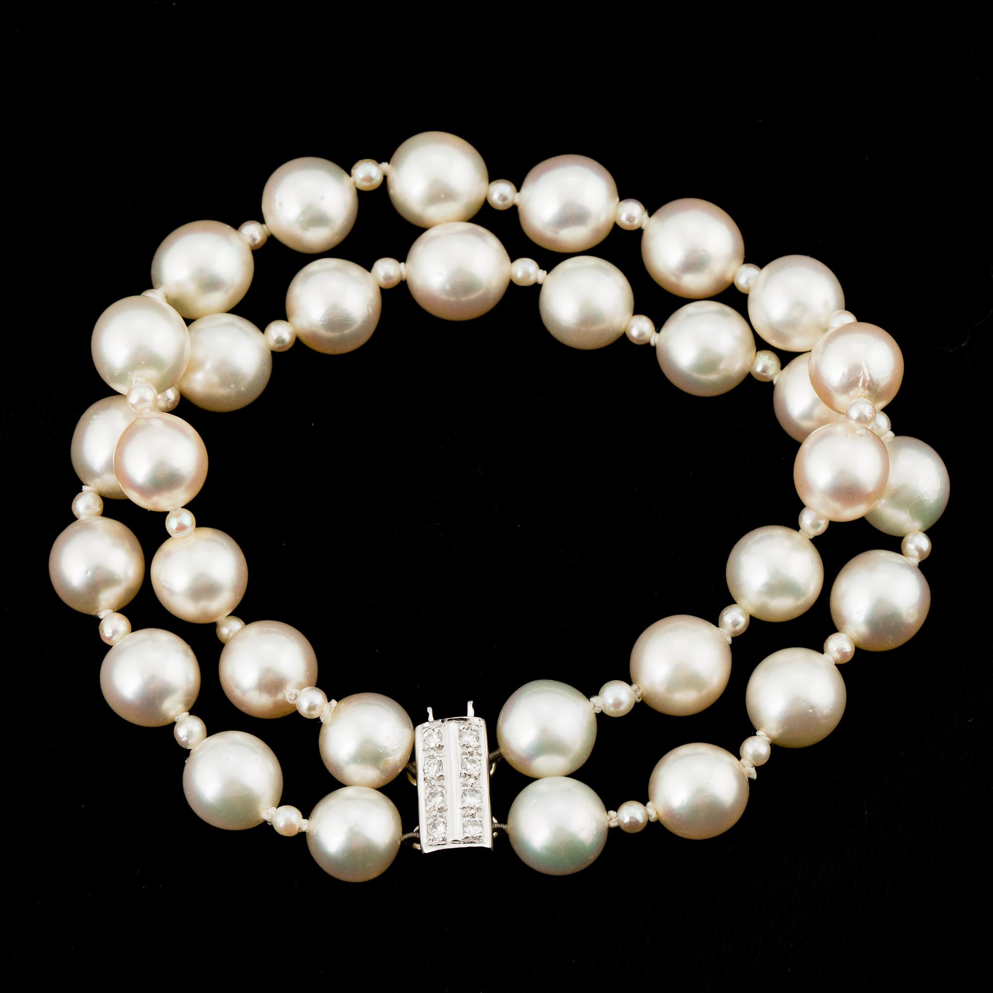 PEARL BRACELET, 2 strands of Akoya pearls with small pearls in between.