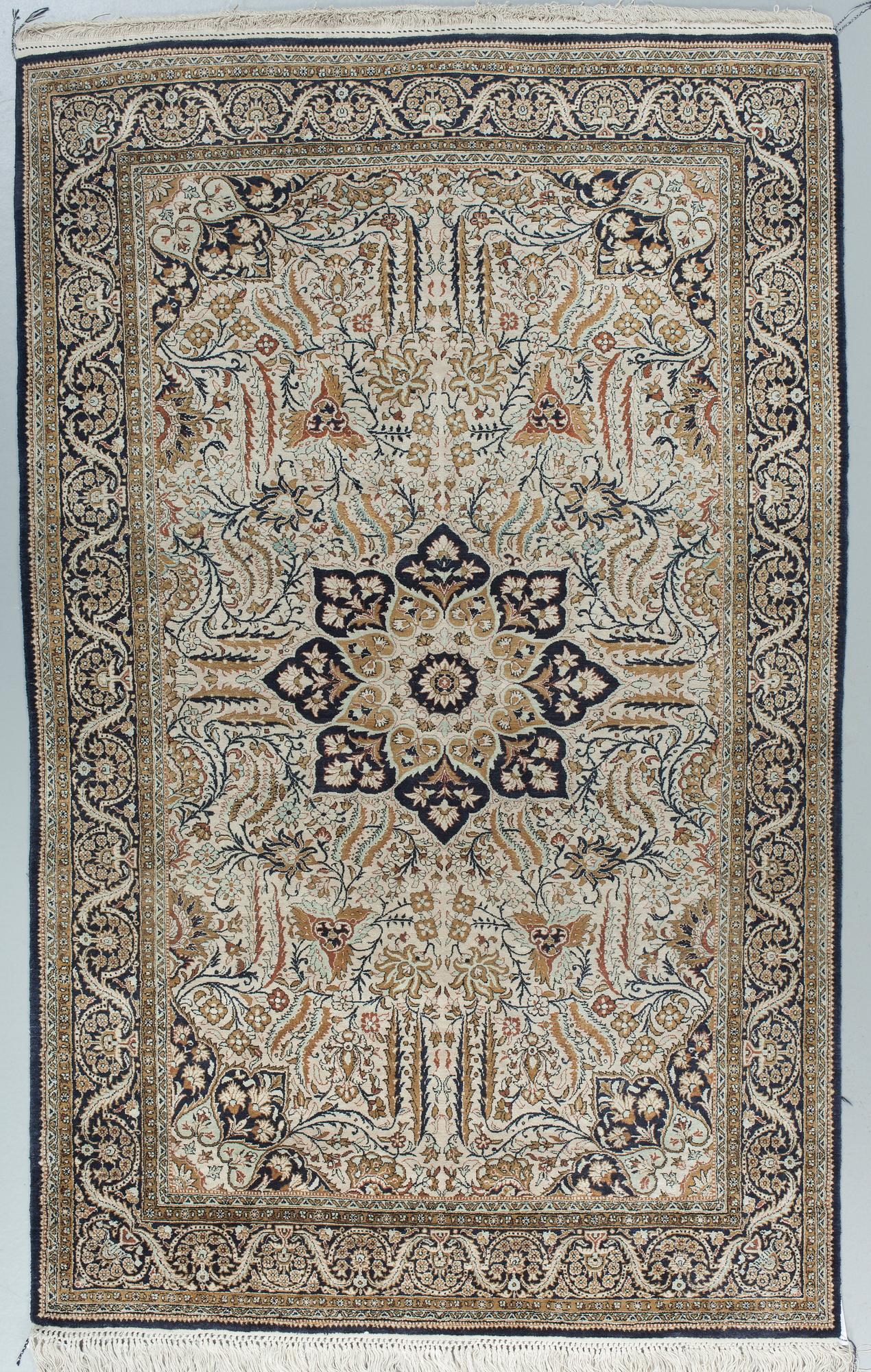 A silk Qum carpet, around  219 x 137 cm.