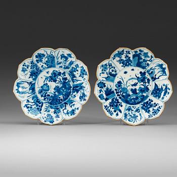 475. Two blue and white dishes of lotus shape decorated with flowers and insects, Qing dynasty, Kangxi (1662-1722).