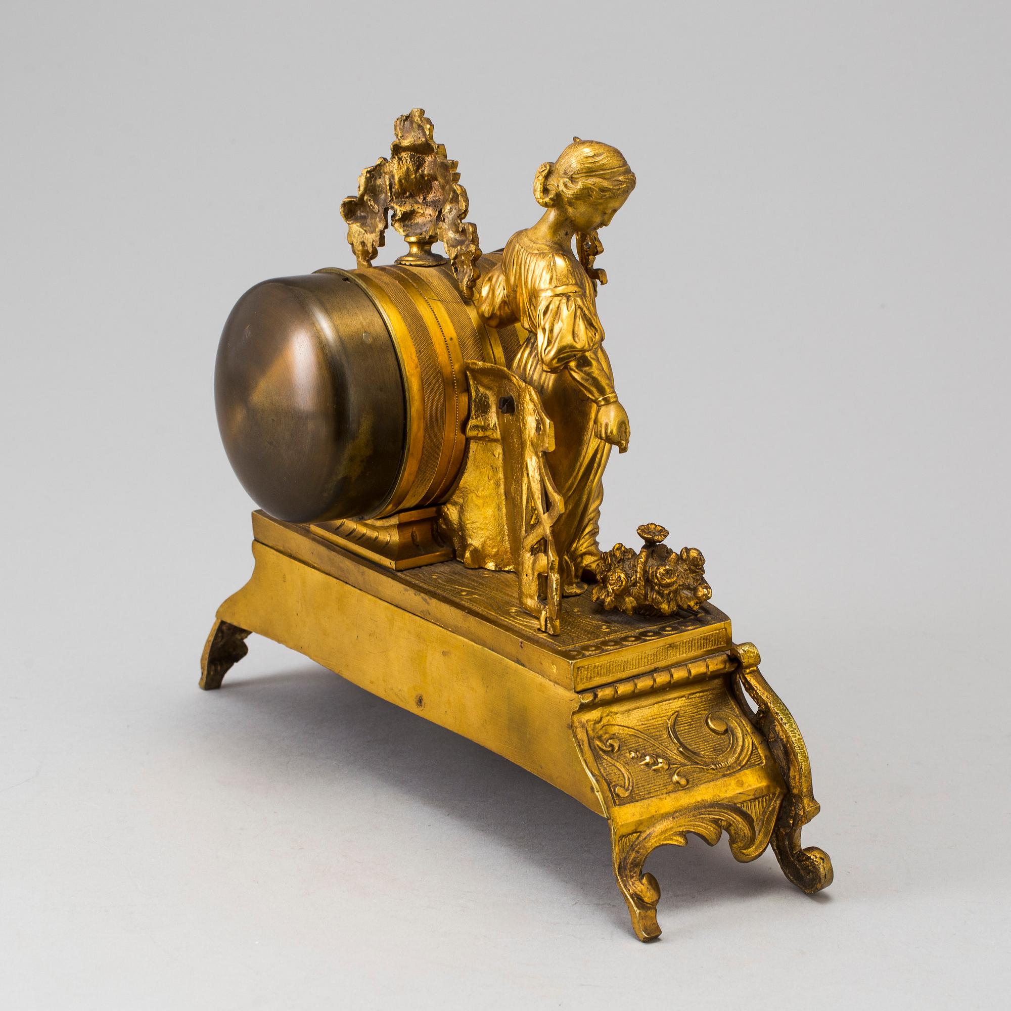 A LATE 19TH CENTURY GILT METAL MANTLE CLOCK in the Rococo style.