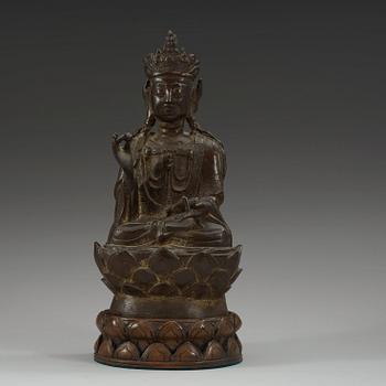 A bronze figure of Guanyin, Ming dynasty with archaistic characters to back.