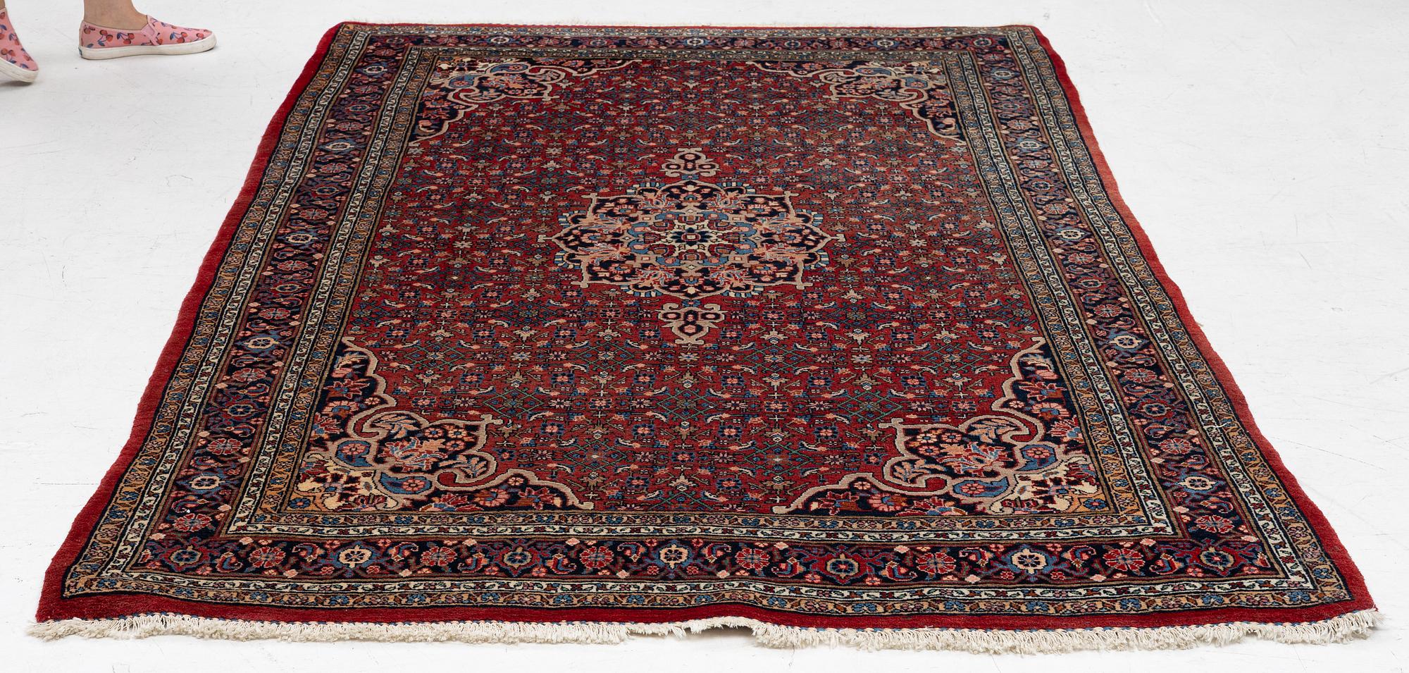 An old Bidjar rug, c. 225 x 143 cm.