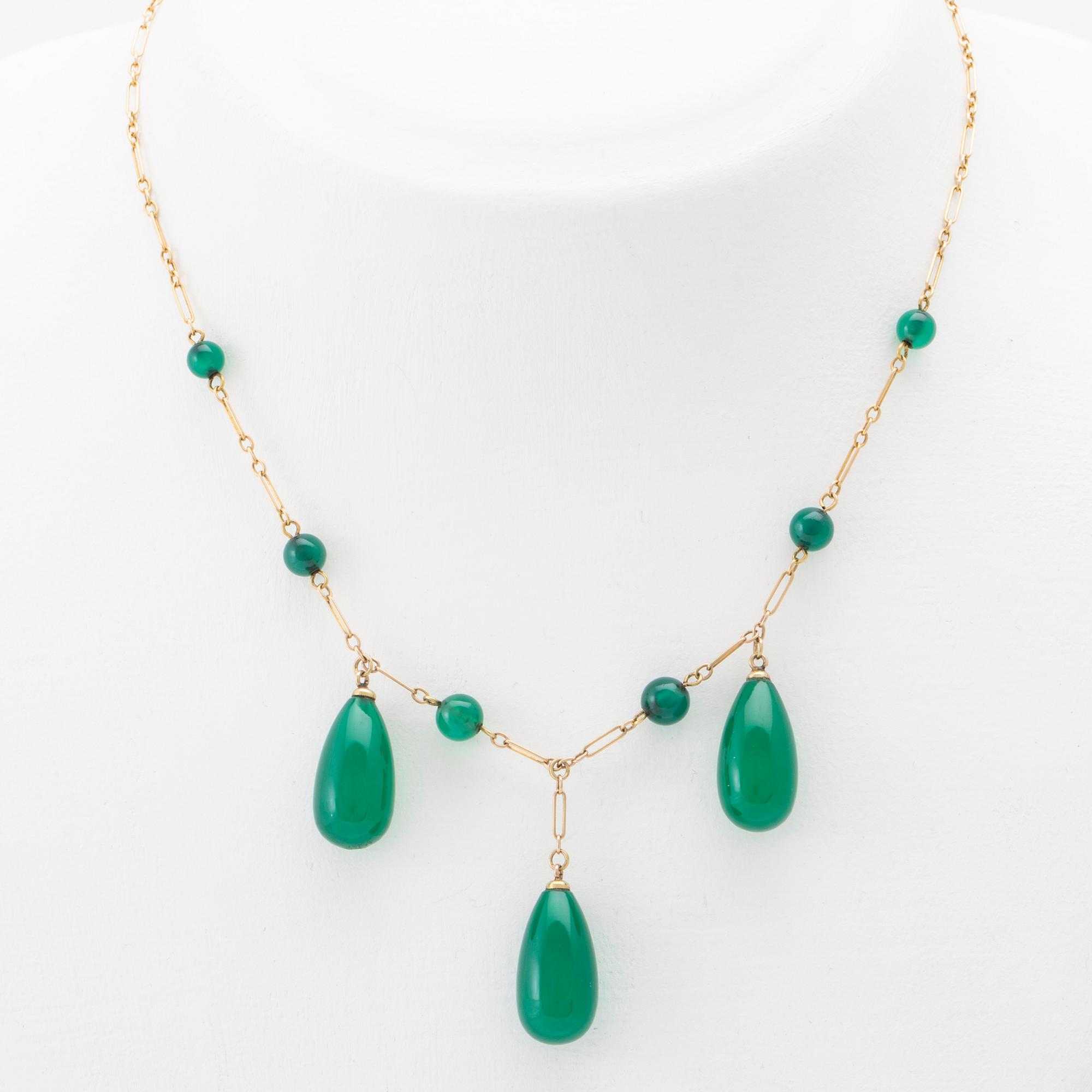 Halsband 18K guld med droppslipade agater.