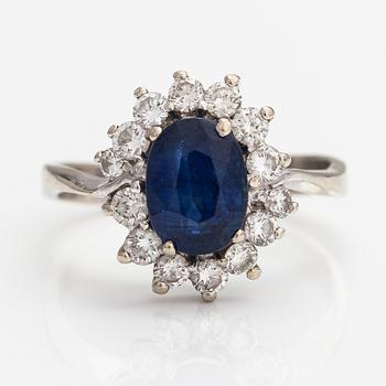 A 18K white gold ring with a sapphire ca. 2.20 ct and diamonds ca. 0.70 ct in total. Finnish import marks 1991.