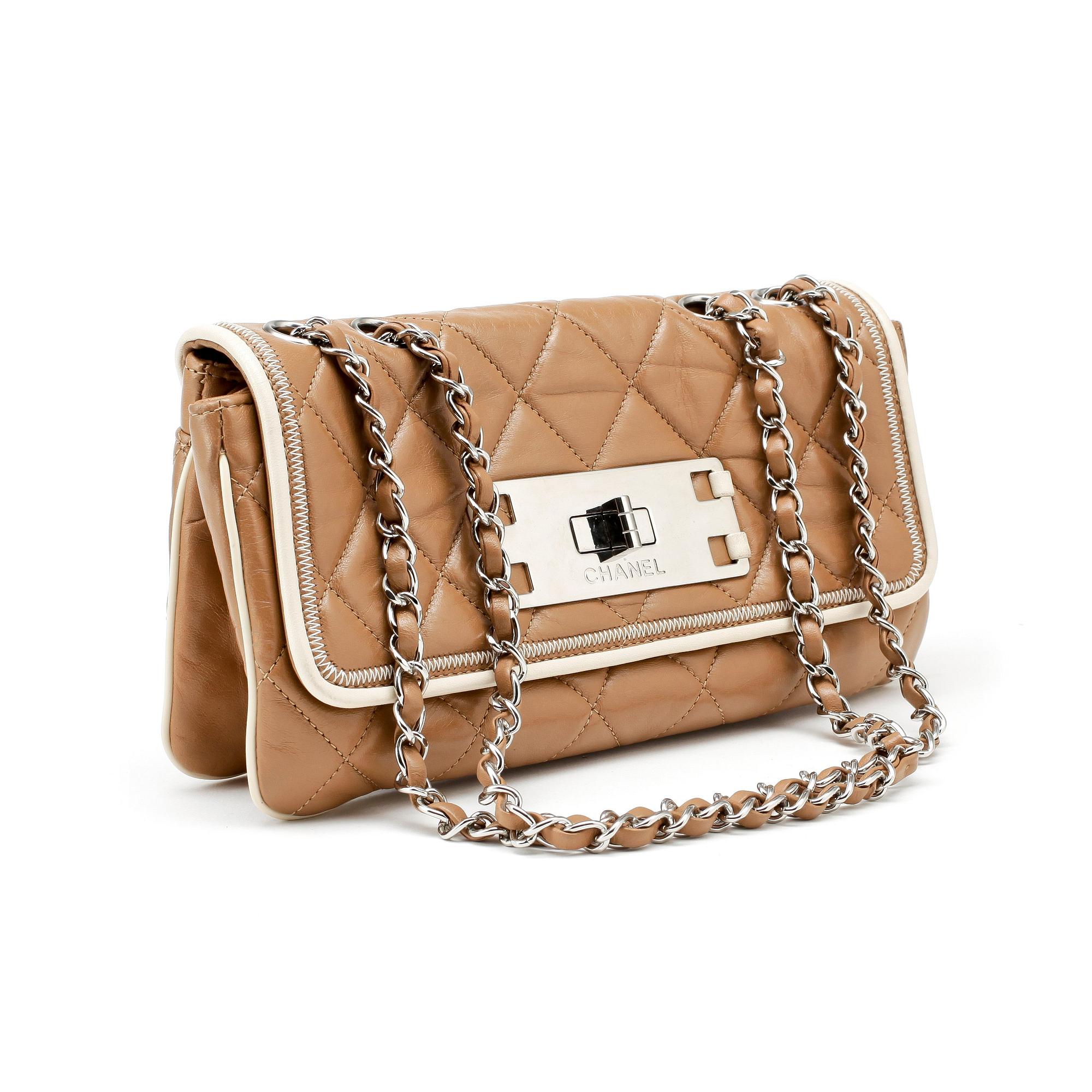 CHANEL, a beige quilted leather flapbag.