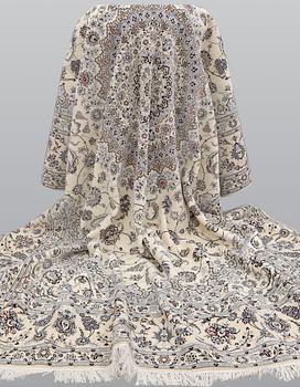 A Nain part silk carpet, 408 x 308 cm.