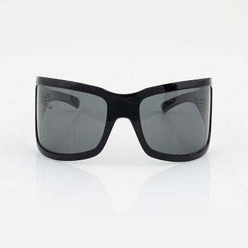 Bottega Veneta, a pair of sunglasses.