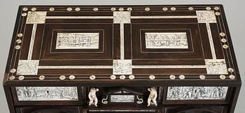 An Italien Baroque-style 19th century cabinet on stand.