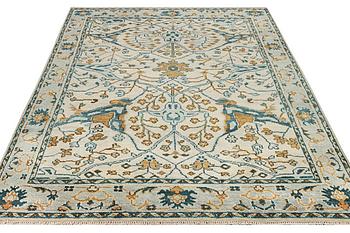 An oriental carpet with Mamluk design, c. 302 x 234 cm.