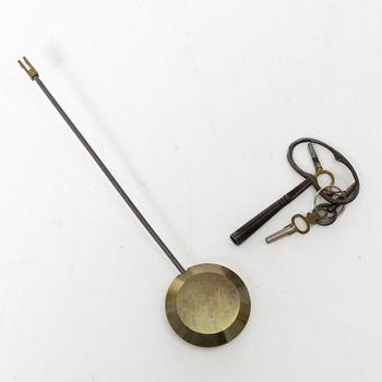 A French Louis XVI-style mantel clock and a pair of candelabra, late 19th Century.