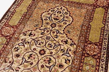 A semi-antique Turkish silk rug, c. 200 x 130 cm.