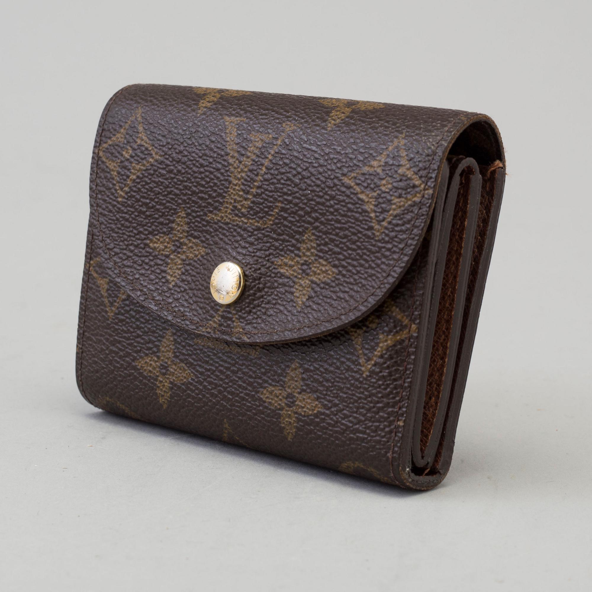 a LOUIS VUITTON 'Helene' wallet.