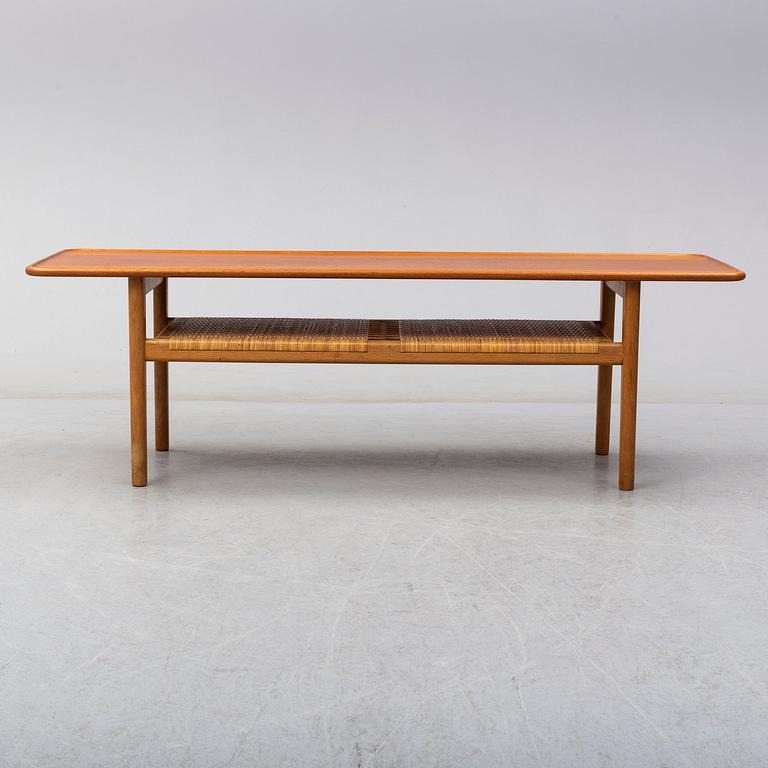 HANS J WEGNER, a teak and oak coffee table from Andreas Tuck, Denmark.