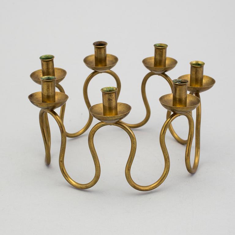 A mid 20th century brass candlestick by Nordiska Kompaniet NK.
