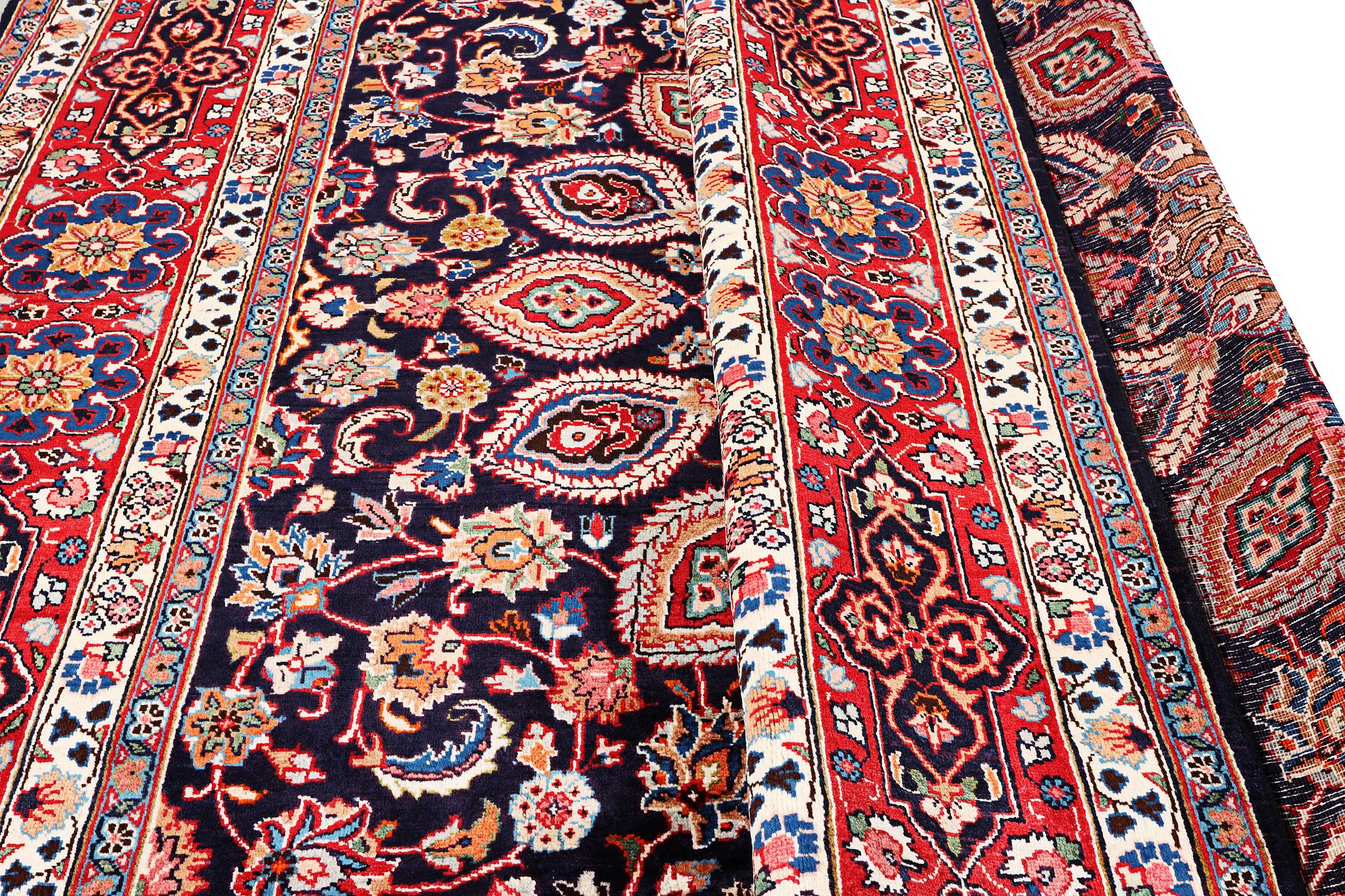 A Meshed carpet, c. 352 x 255 cm.