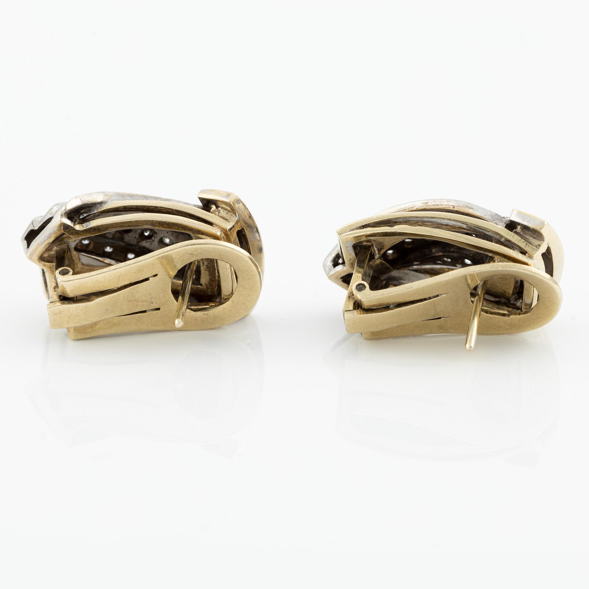 Gold earrings with brilliant-cut and octagon-cut diamonds.