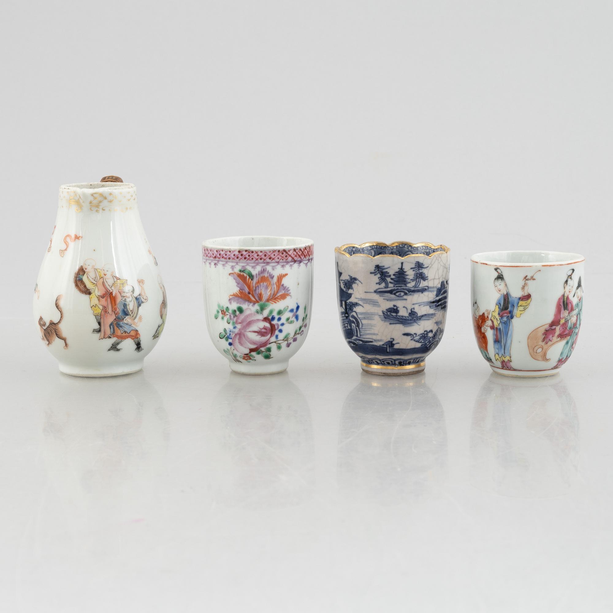 A creamer, seven porcelain cups and seven saucers, China, Qing dynasty, 18th century.