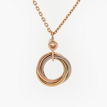 Cartier, an 18K gold 'Trinity Pendant' necklace with a brilliant-cut diamond.
