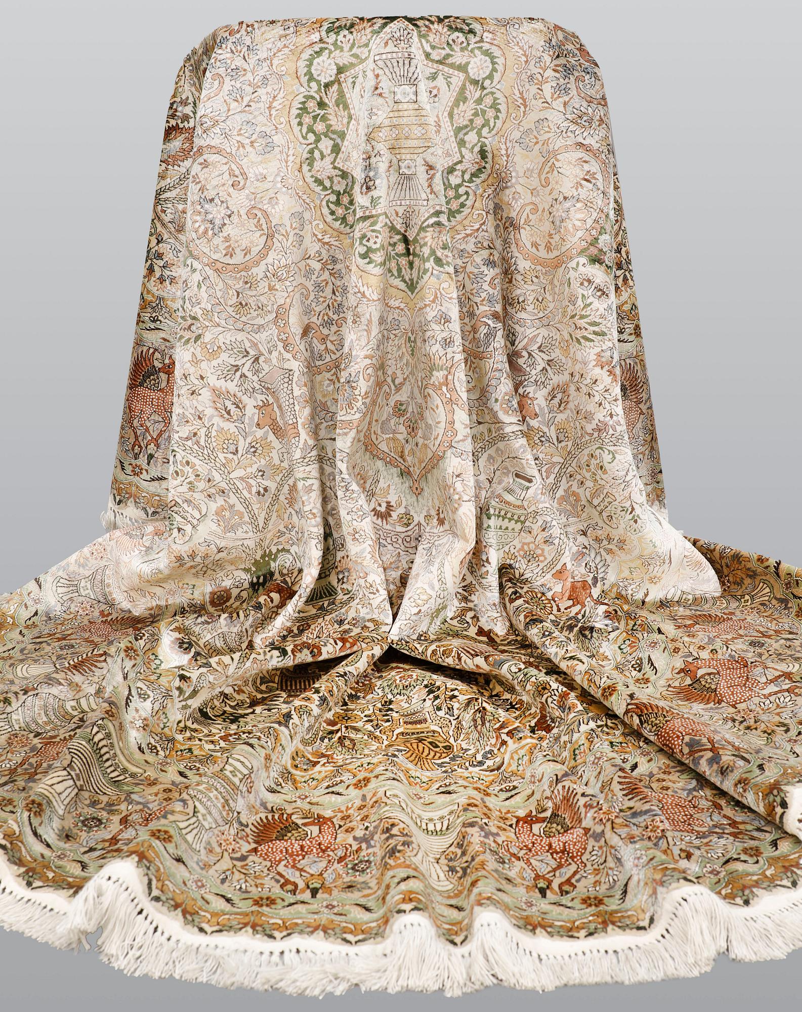 A figural Oriental silk carpet, approx. 273 x 180 cm.