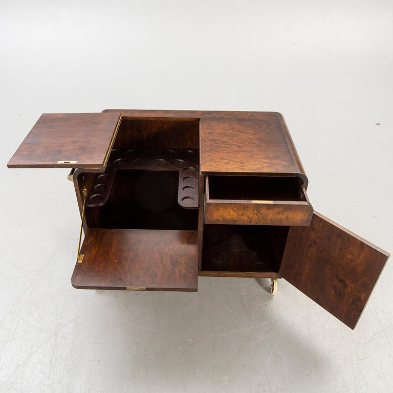 A stained birch bar cabinet from NK dated 1936.