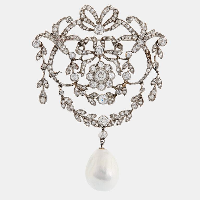 A platinum brooch set with old-cut diamonds and with a drop shaped pearl.