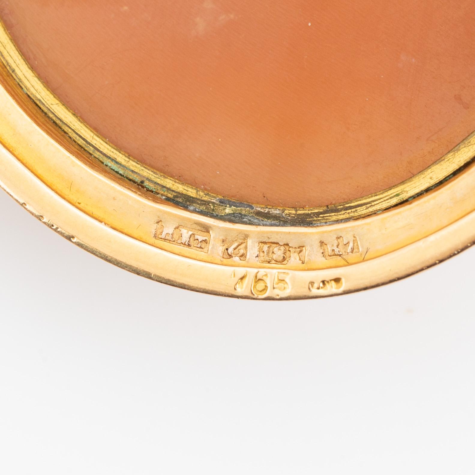 Gold and carved sea shell cameo.