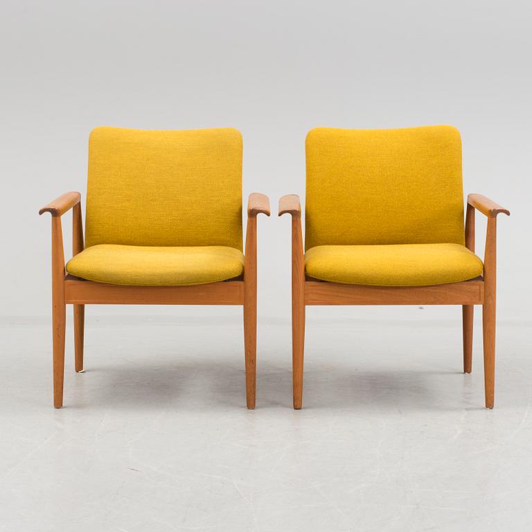 A pair of "Diplomat" easy chairs by Finn Juhl.