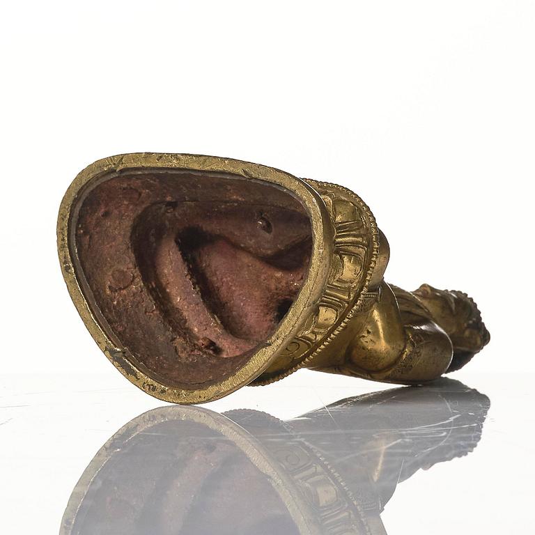 A gilt bronze figure of Shakyamuni buddha, Tibeto-Chinese, 18th century.