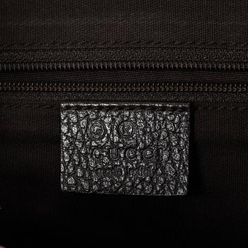 Gucci, GG Supreme bag.