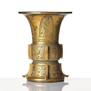 A parcel gilt/gold splashed bronze vase, Gu, 17/18th century.