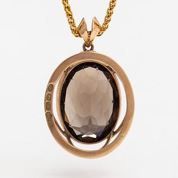 A 14K and 18K gold necklace with a smoky quartz. Olavi Nupponen, Helsinki 1963 and Tillander, Helsinki 1996.